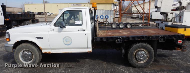 image for item DC8734 1997 Ford F250 flatbed pickup truck