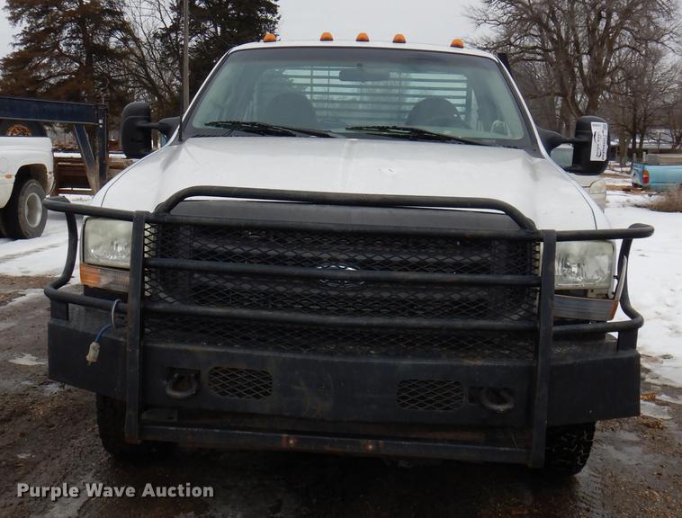 image for item DE0099 2002 Ford F350 Super Duty XL flatbed pickup truck