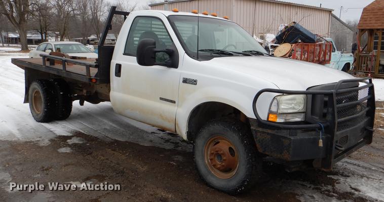 image for item DE0099 2002 Ford F350 Super Duty XL flatbed pickup truck