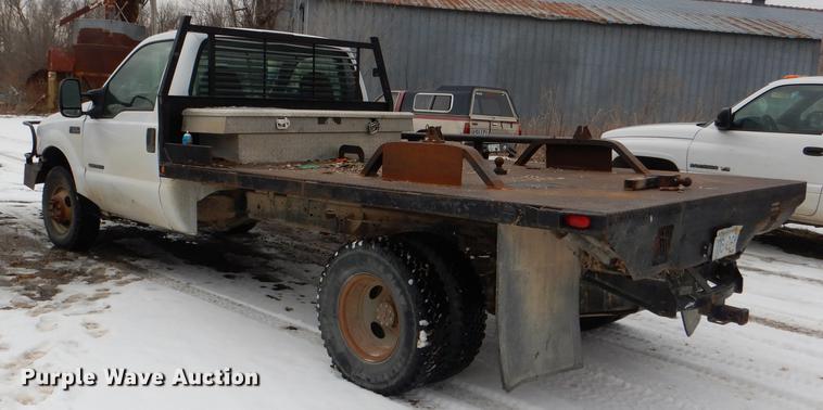 image for item DE0099 2002 Ford F350 Super Duty XL flatbed pickup truck
