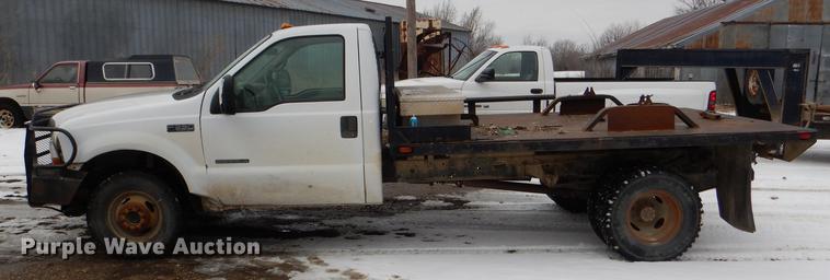 image for item DE0099 2002 Ford F350 Super Duty XL flatbed pickup truck