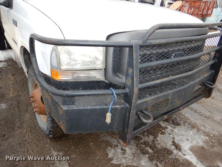 image for item DE0099 2002 Ford F350 Super Duty XL flatbed pickup truck