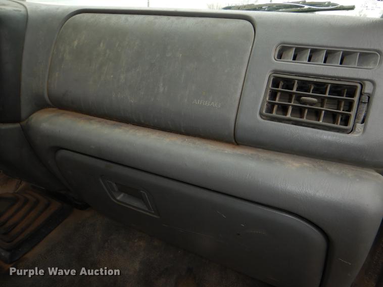 image for item DE0099 2002 Ford F350 Super Duty XL flatbed pickup truck