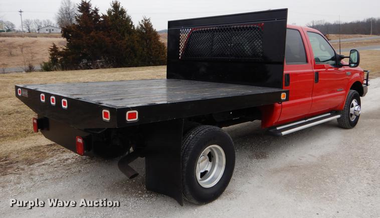 image for item DE6030 2001 Ford F350 Super Duty XLT Crew Cab flatbed pickup truck