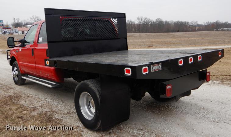 image for item DE6030 2001 Ford F350 Super Duty XLT Crew Cab flatbed pickup truck