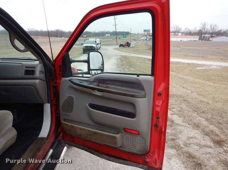 image for item DE6030 2001 Ford F350 Super Duty XLT Crew Cab flatbed pickup truck