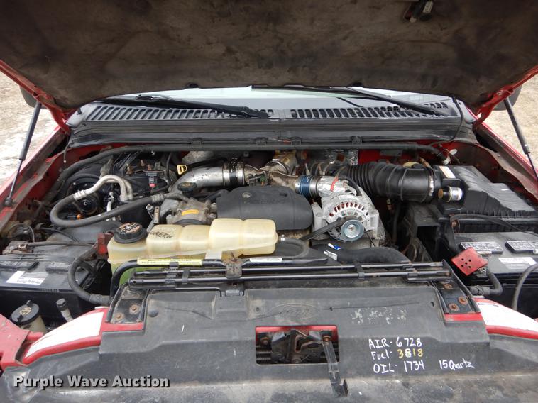 image for item DE6030 2001 Ford F350 Super Duty XLT Crew Cab flatbed pickup truck