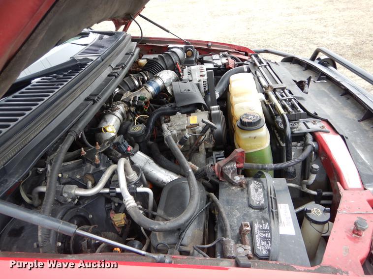 image for item DE6030 2001 Ford F350 Super Duty XLT Crew Cab flatbed pickup truck