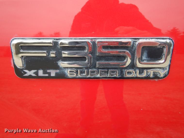 image for item DE6030 2001 Ford F350 Super Duty XLT Crew Cab flatbed pickup truck