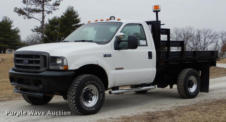 image for item DE6031 2004 Ford F350 Super Duty XL flatbed pickup truck