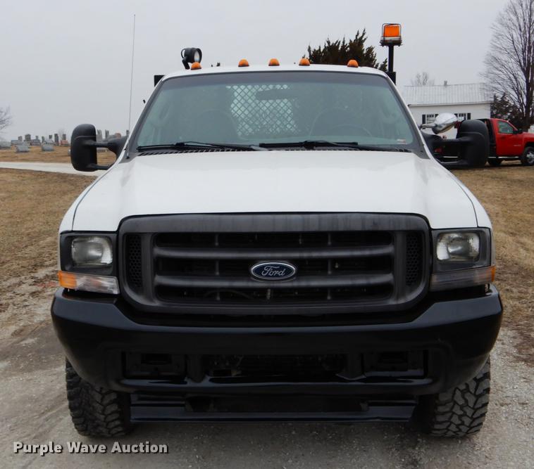 image for item DE6031 2004 Ford F350 Super Duty XL flatbed pickup truck