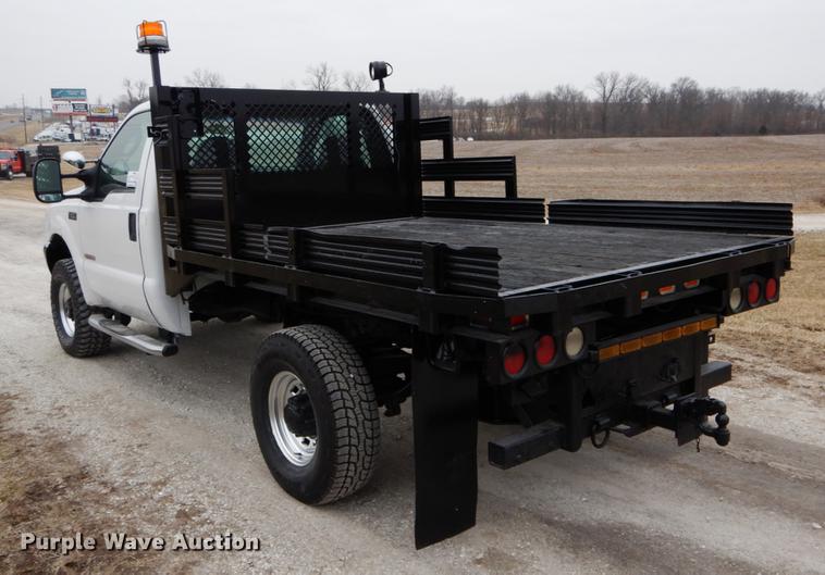 image for item DE6031 2004 Ford F350 Super Duty XL flatbed pickup truck
