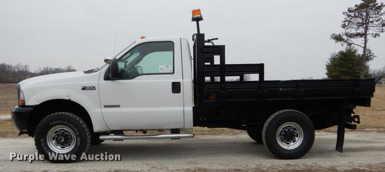 image for item DE6031 2004 Ford F350 Super Duty XL flatbed pickup truck