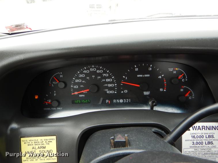 image for item DE6031 2004 Ford F350 Super Duty XL flatbed pickup truck