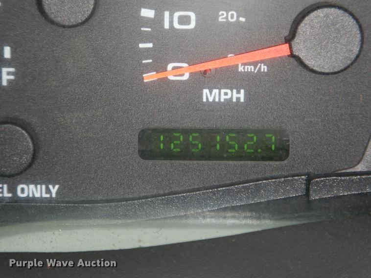 image for item DE6031 2004 Ford F350 Super Duty XL flatbed pickup truck