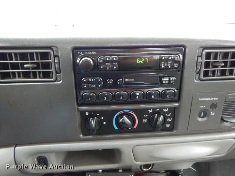 image for item DE6031 2004 Ford F350 Super Duty XL flatbed pickup truck