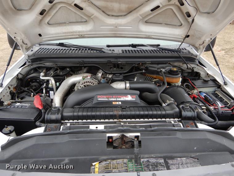 image for item DE6031 2004 Ford F350 Super Duty XL flatbed pickup truck