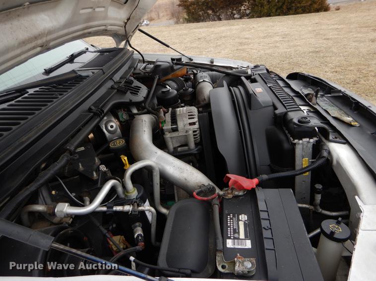 image for item DE6031 2004 Ford F350 Super Duty XL flatbed pickup truck