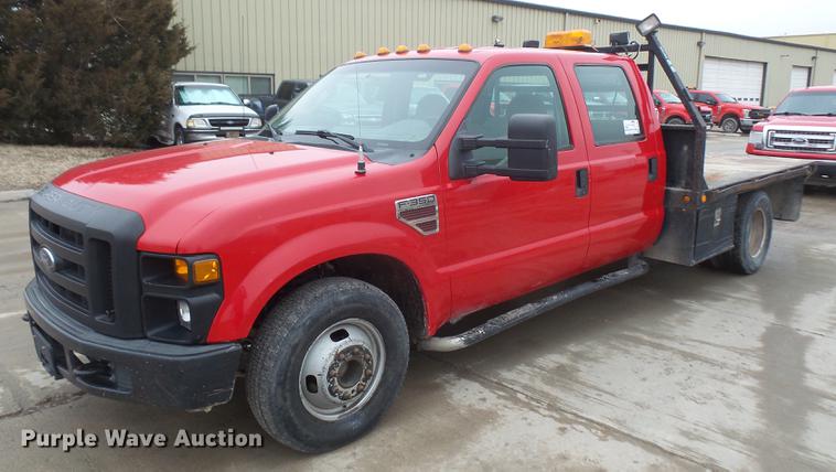 image for item DF7665 2010 Ford F350 Super Duty Crew Cab flatbed pickup truck