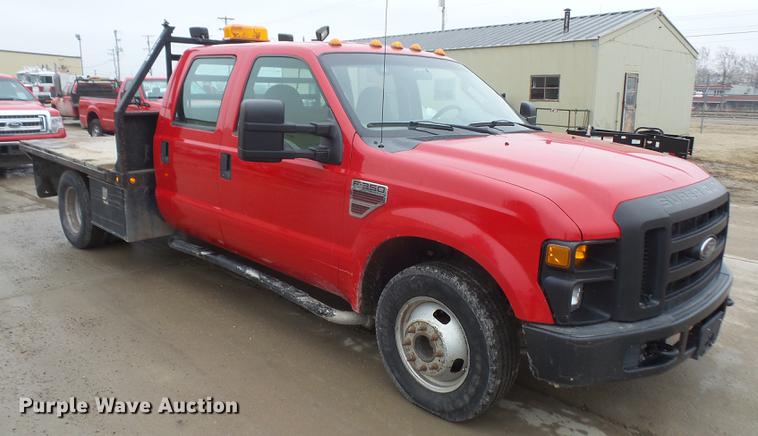 image for item DF7665 2010 Ford F350 Super Duty Crew Cab flatbed pickup truck