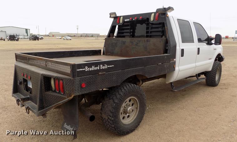 image for item FH9064 2005 Ford F350 Super Duty Crew Cab flatbed pickup truck