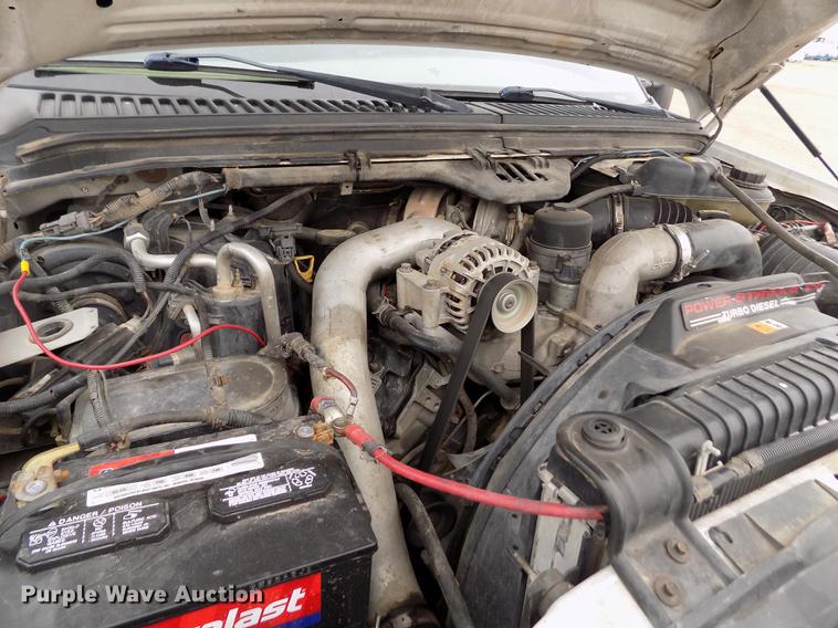 image for item FH9064 2005 Ford F350 Super Duty Crew Cab flatbed pickup truck