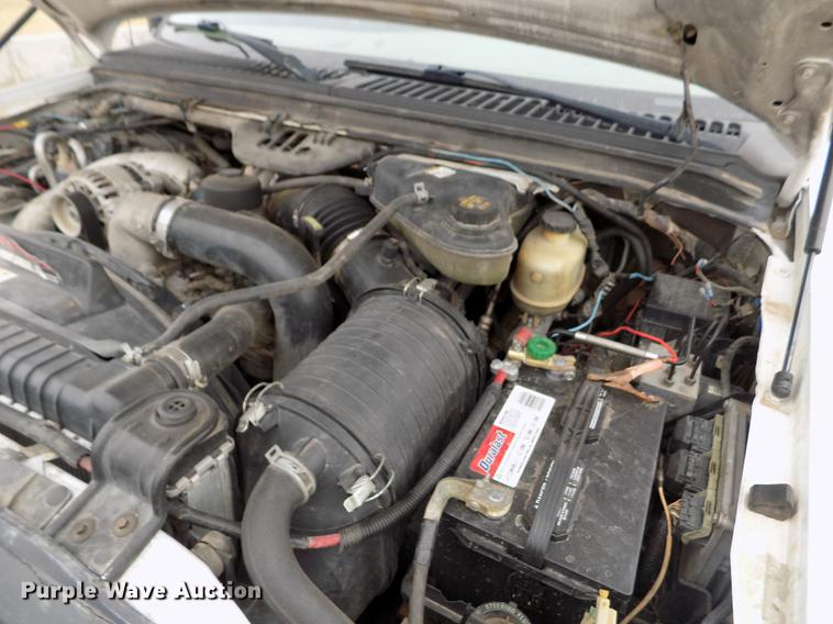 image for item FH9064 2005 Ford F350 Super Duty Crew Cab flatbed pickup truck