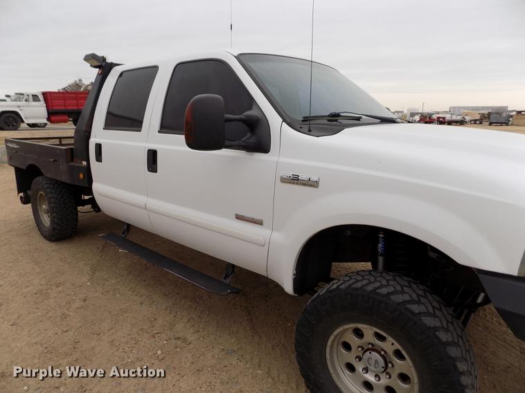 image for item FH9064 2005 Ford F350 Super Duty Crew Cab flatbed pickup truck
