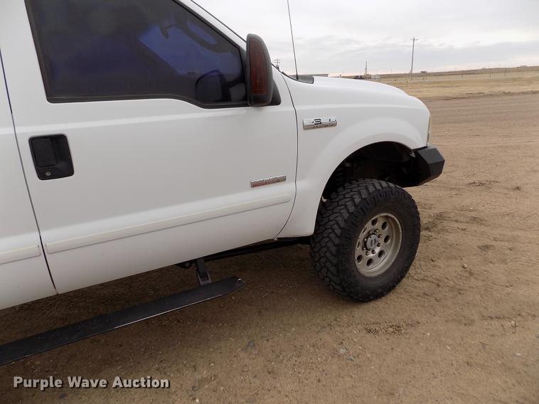 image for item FH9064 2005 Ford F350 Super Duty Crew Cab flatbed pickup truck