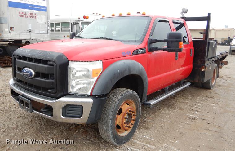 image for item FQ9707 2011 Ford F450 Super Duty Crew Cab flatbed truck with crane