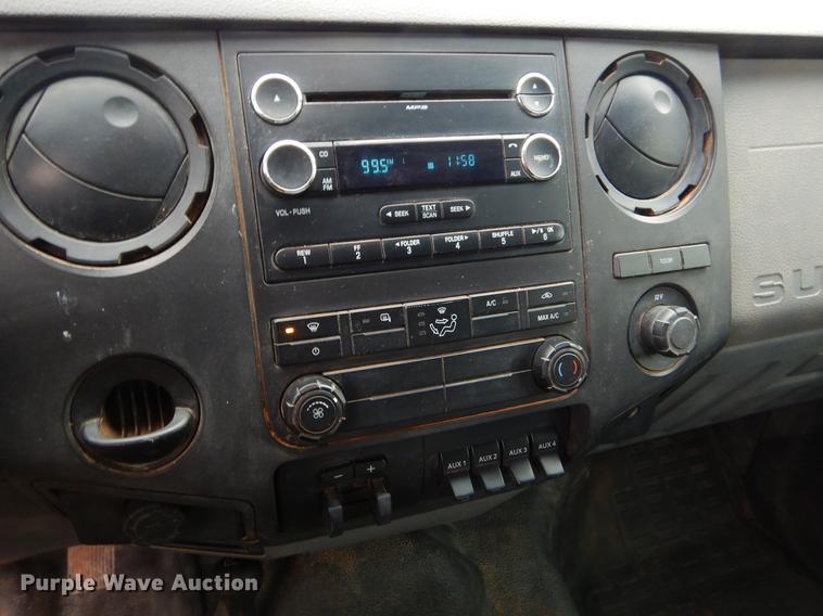 image for item FQ9707 2011 Ford F450 Super Duty Crew Cab flatbed truck with crane