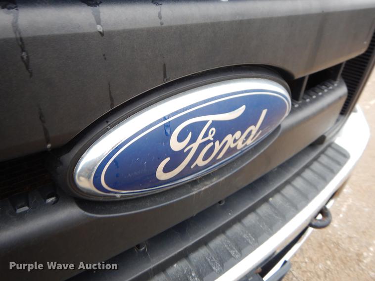 image for item FQ9707 2011 Ford F450 Super Duty Crew Cab flatbed truck with crane