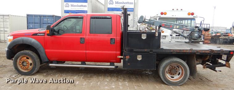image for item FQ9707 2011 Ford F450 Super Duty Crew Cab flatbed truck with crane