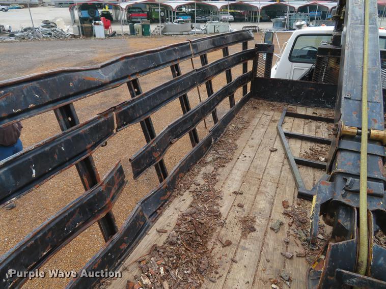 image for item DG3898 1992 Ford F700 flatbed truck with crane