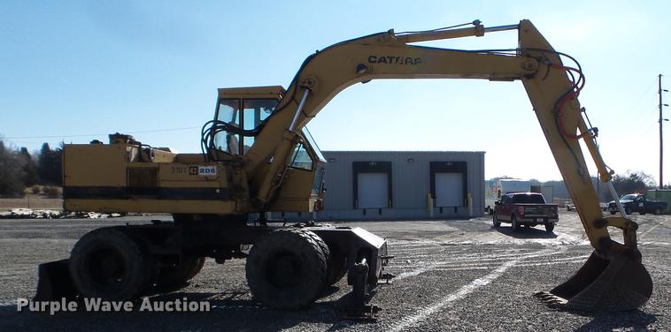 image for item EW9985 1985 Caterpillar 206 rubber tire excavator