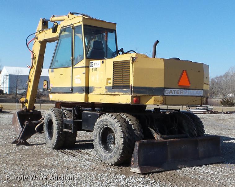 image for item EW9985 1985 Caterpillar 206 rubber tire excavator