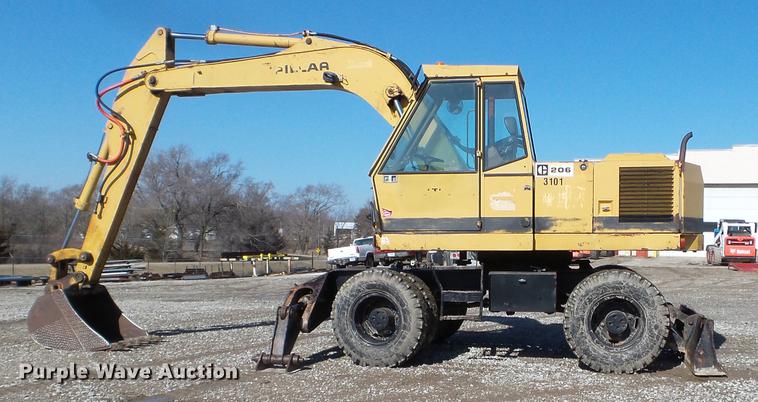 image for item EW9985 1985 Caterpillar 206 rubber tire excavator