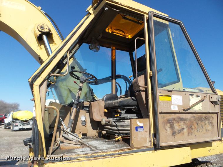 image for item EW9985 1985 Caterpillar 206 rubber tire excavator