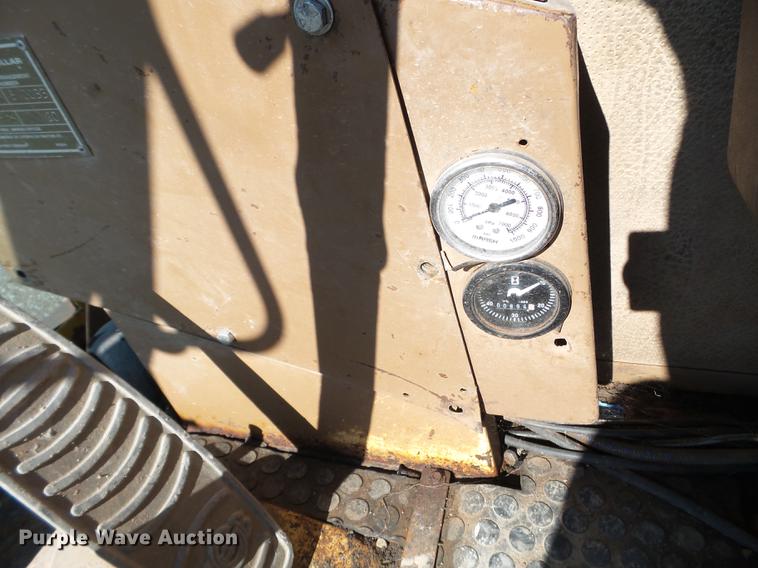 image for item EW9985 1985 Caterpillar 206 rubber tire excavator