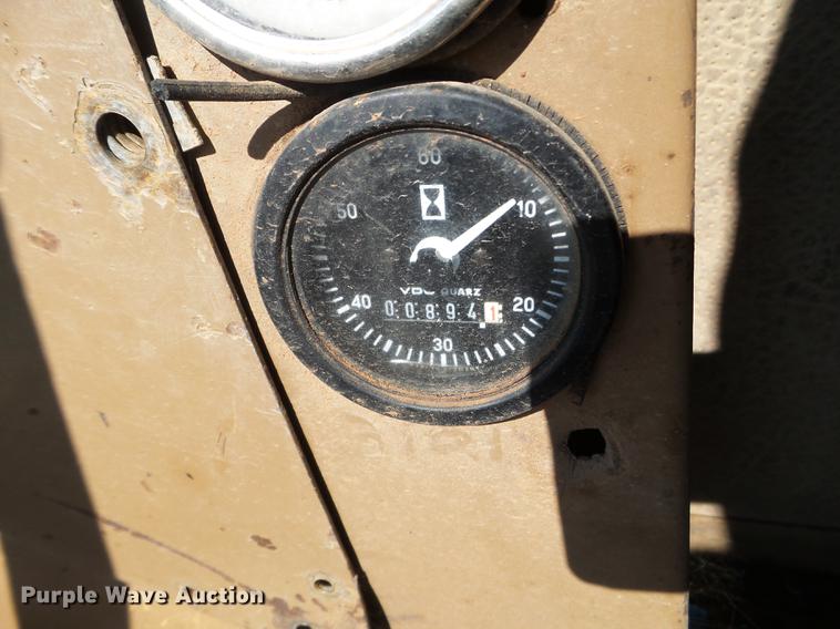 image for item EW9985 1985 Caterpillar 206 rubber tire excavator