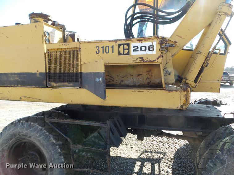 image for item EW9985 1985 Caterpillar 206 rubber tire excavator