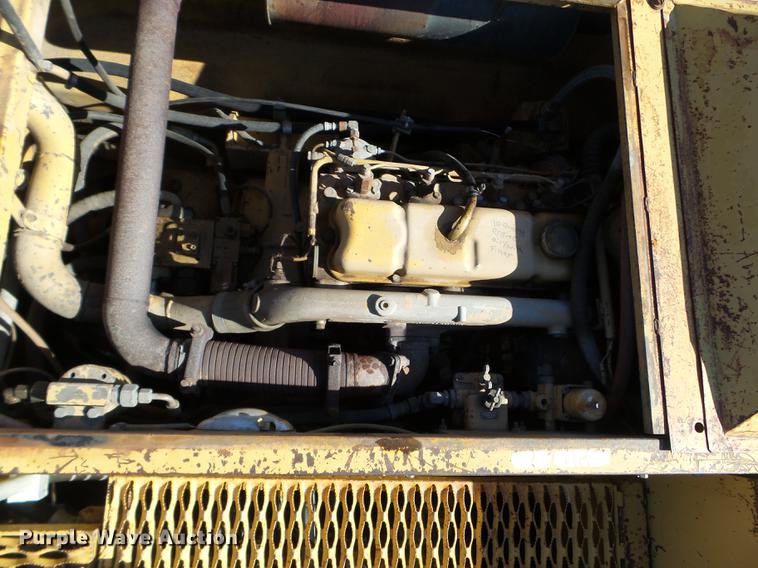 image for item EW9985 1985 Caterpillar 206 rubber tire excavator