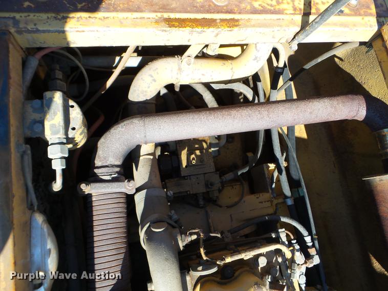 image for item EW9985 1985 Caterpillar 206 rubber tire excavator