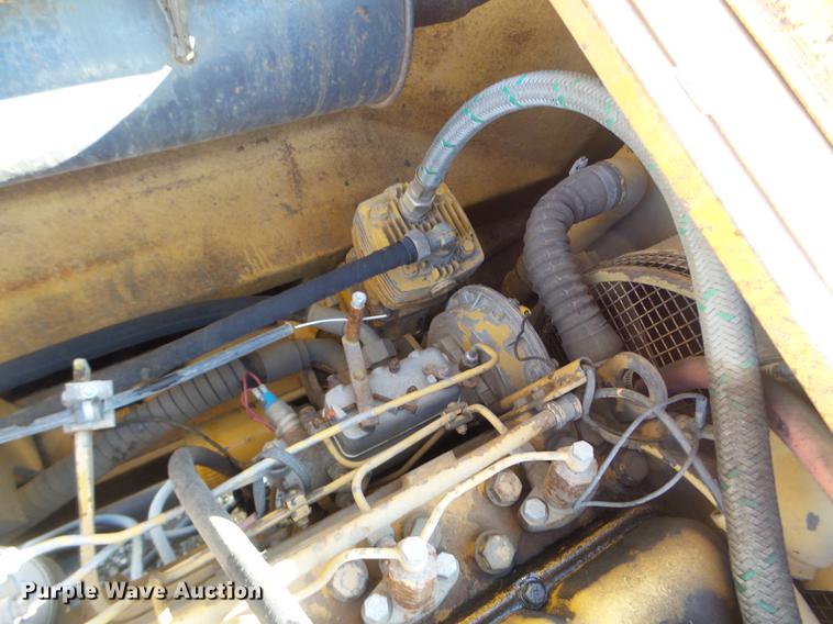 image for item EW9985 1985 Caterpillar 206 rubber tire excavator