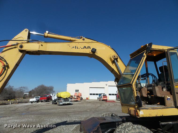 image for item EW9985 1985 Caterpillar 206 rubber tire excavator