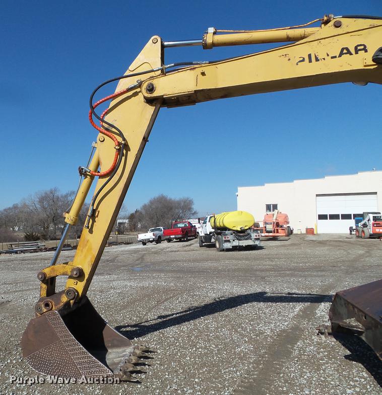 image for item EW9985 1985 Caterpillar 206 rubber tire excavator