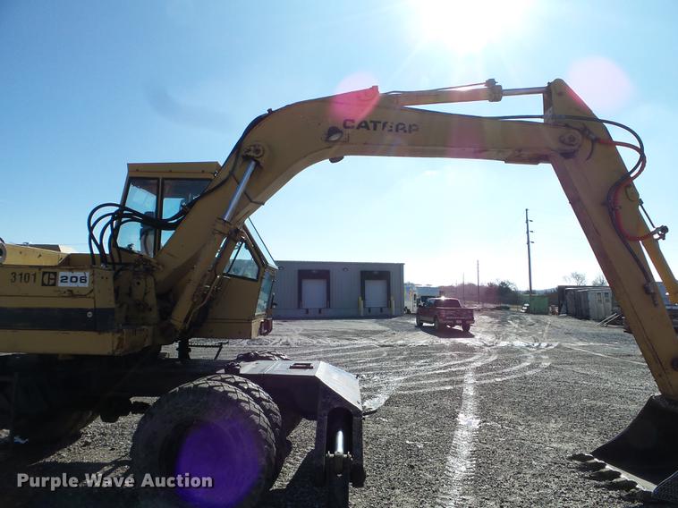 image for item EW9985 1985 Caterpillar 206 rubber tire excavator