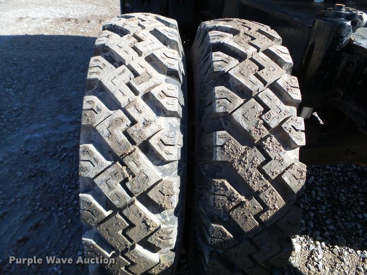 image for item EW9985 1985 Caterpillar 206 rubber tire excavator