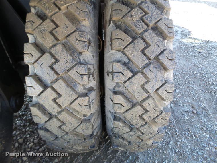 image for item EW9985 1985 Caterpillar 206 rubber tire excavator