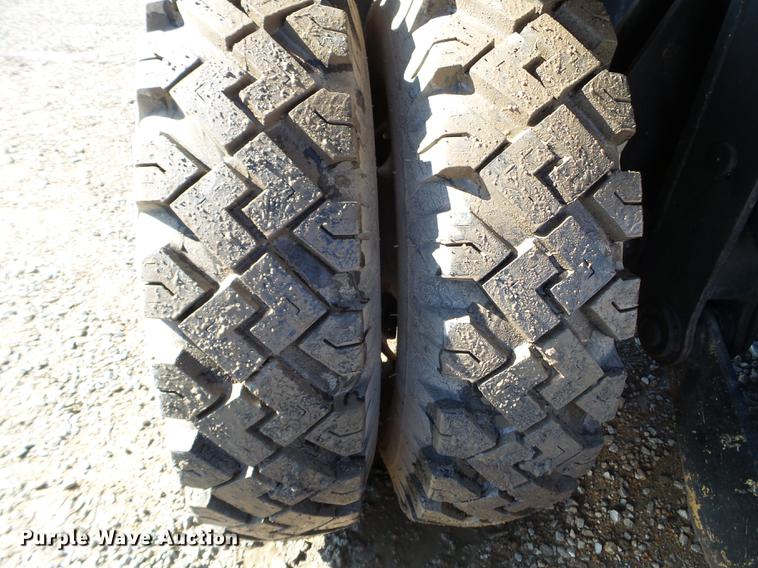image for item EW9985 1985 Caterpillar 206 rubber tire excavator